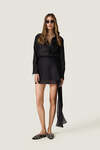 Black loose dress with an asymmetric cut and flowing side detail
